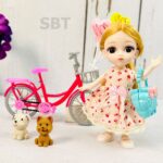 عروسک چشم تیله ای با دوچرخه وارداتی مامزنینی